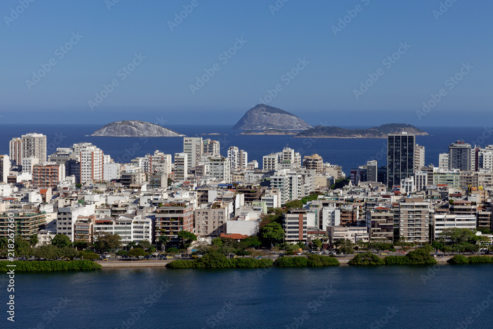 Fototapeta premium Neighbourhood of Ipanema in Rio de Janeiro with in the foreground the city lake and in the background the Atlantic ocean with a few islands off the coast