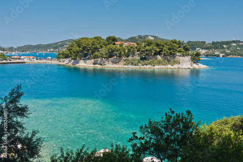View on a small island in front of Skiathos town waterfront and harbor, Skiathos island, Greece