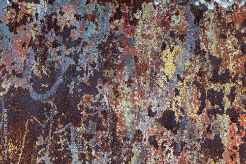 Multicolored background. Rusty metal surface with paint flaking and cracking texture