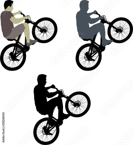 silhouette male on bicycle