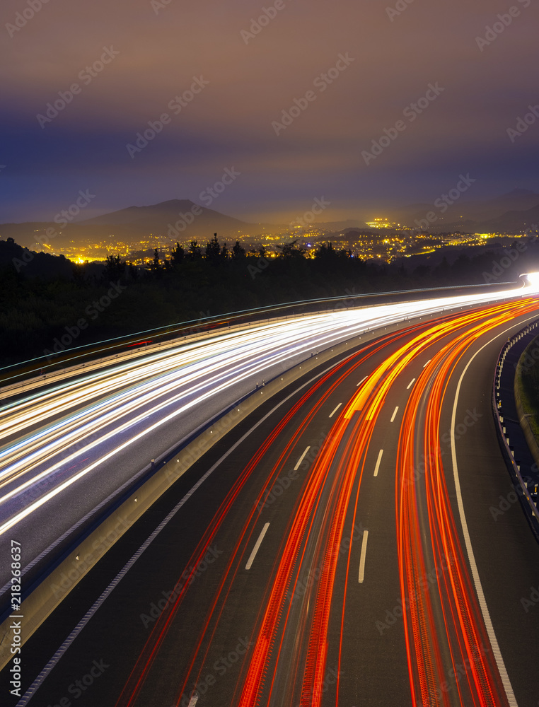 Car lights on the highway in the direction of the city of San Sebastian