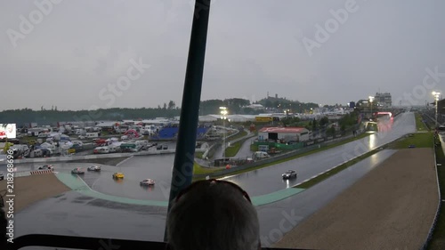 race at nuerburgring with gt3 cars in the rain, wideshot, plus safety car. photo