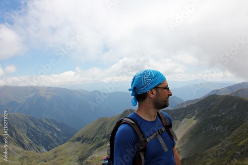 Climber portrait - man on the highest peek photo