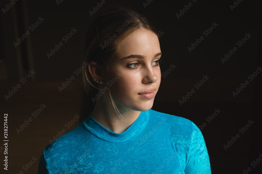 Ballerina looking away at dance studio Ballerina looking away at dance studio