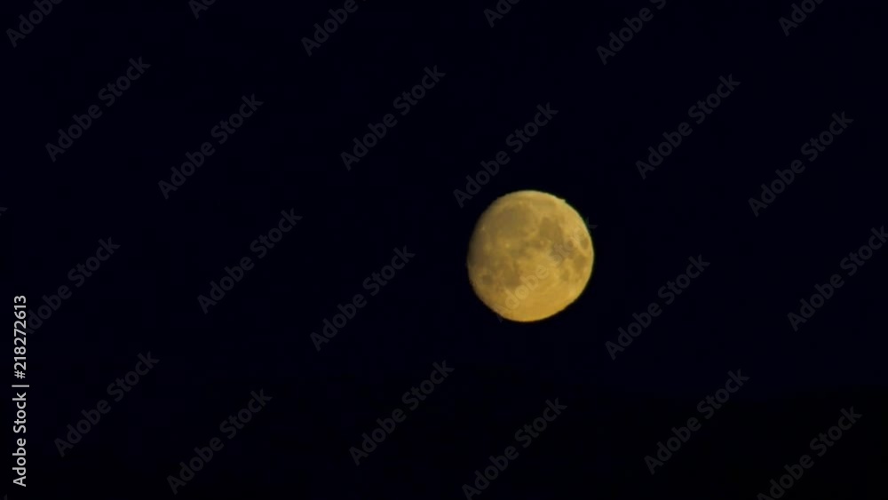 An amazing bright full moon against a clear black night sky. CLOSE UP. An amazing bright full moon against a clear black night sky. CLOSE UP.