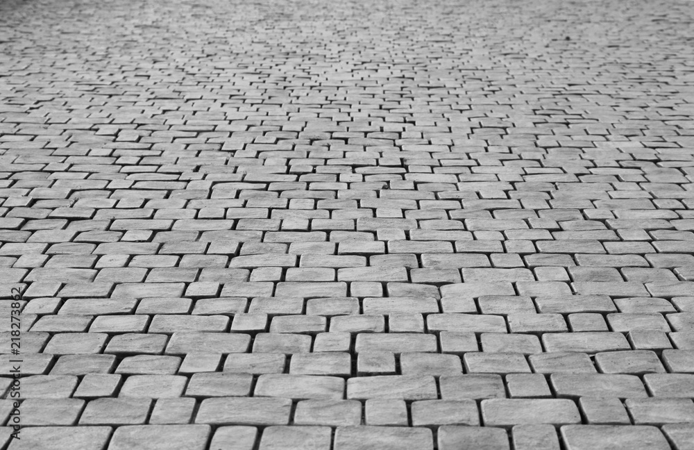 Old cobblestone pavement of square stones near the Sugarloaf Mountain. Republic of Crimea. Abstract background