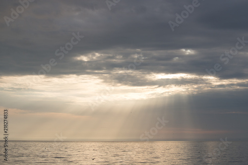 The sun's rays over the sea in the evening