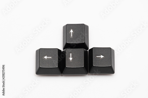 Single black keys of keyboard with different letters arrow keys