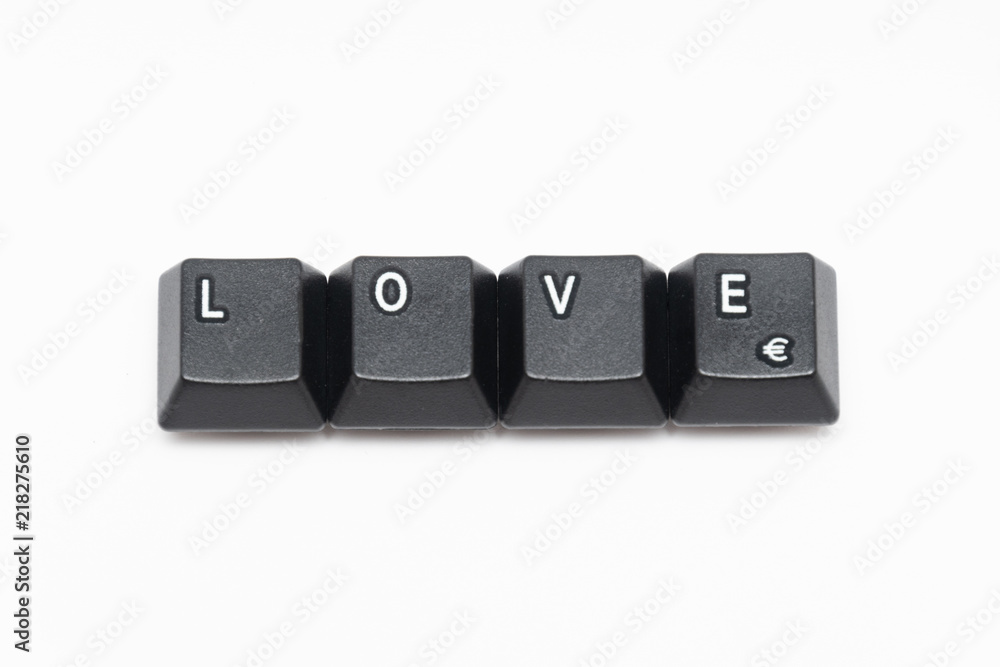 Single black keys of keyboard with different letters LOVE