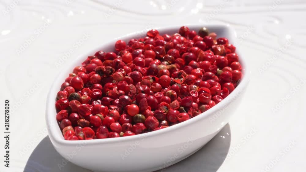 Dry spices pink pepper on a rotary table. 4K. Macroshooting. Dry spices pink pepper on a rotary table. 4K. Macroshooting.