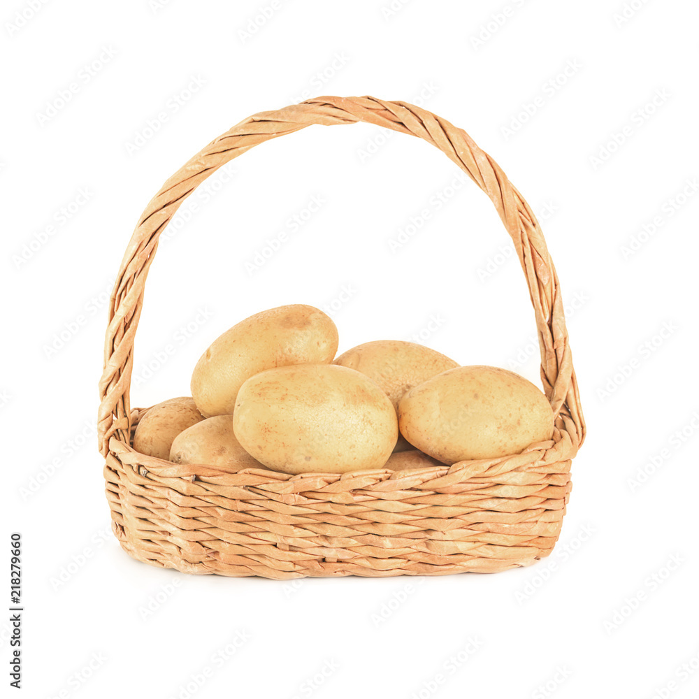 Potatoes in wicker basket on green background. Potatoes in wicker basket on green background.