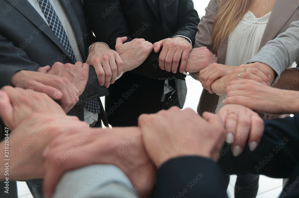 close up.business team showing their unity close up.business team showing their unity