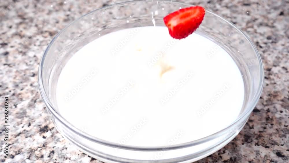 Falling of strawberry in milk. Slow motion. Shooting of fruit. Falling of strawberry in milk. Slow motion. Shooting of fruit.