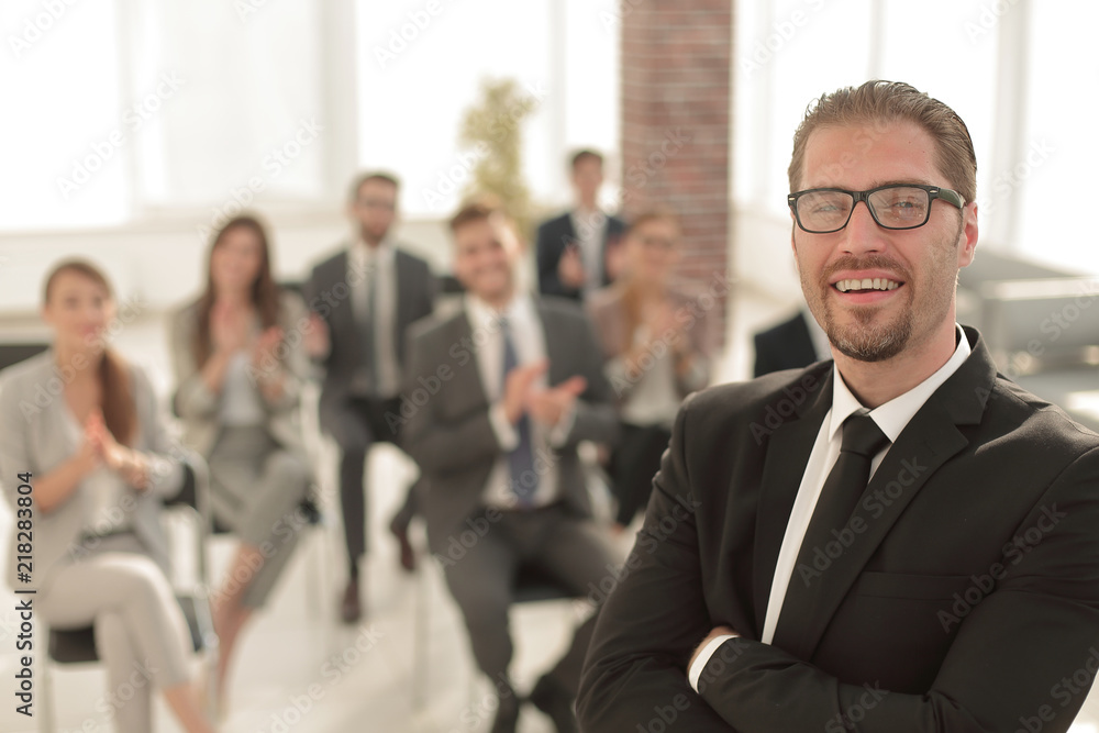 confident businessman on the background of the conference room confident businessman on the background of the conference room