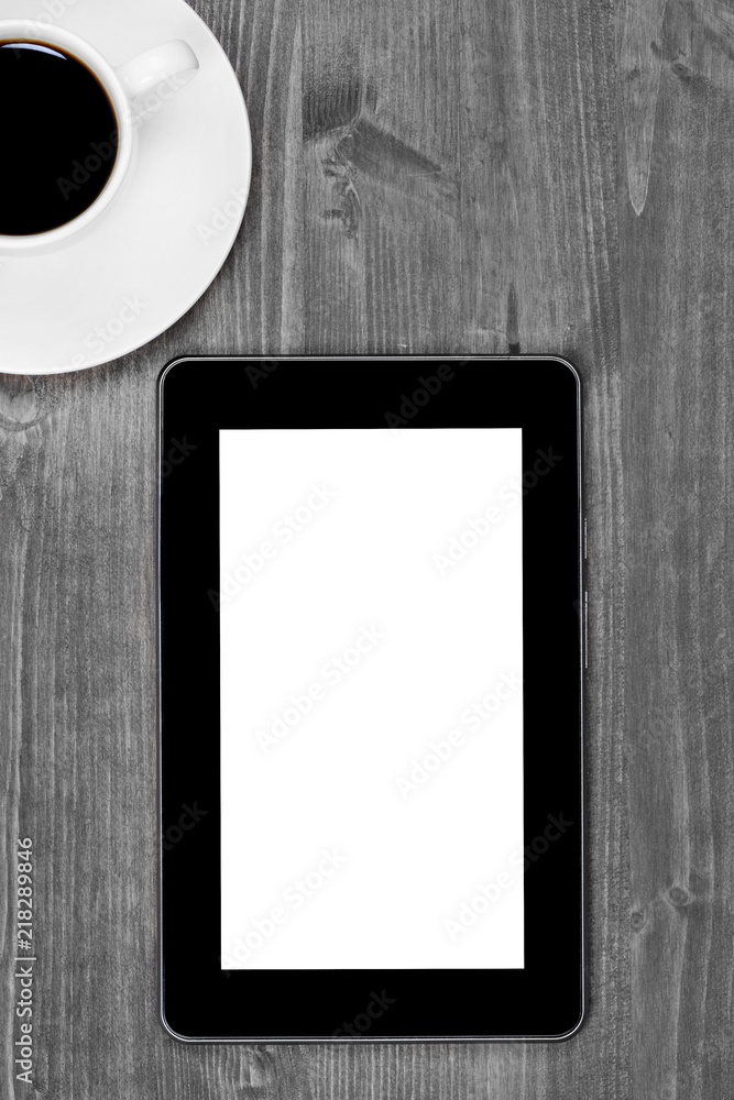 Digital tablet pc with coffee cup on desk Digital tablet pc with coffee cup on desk