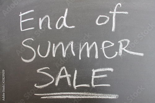 'End of Summer Sale' handwritten text on a blackboard.