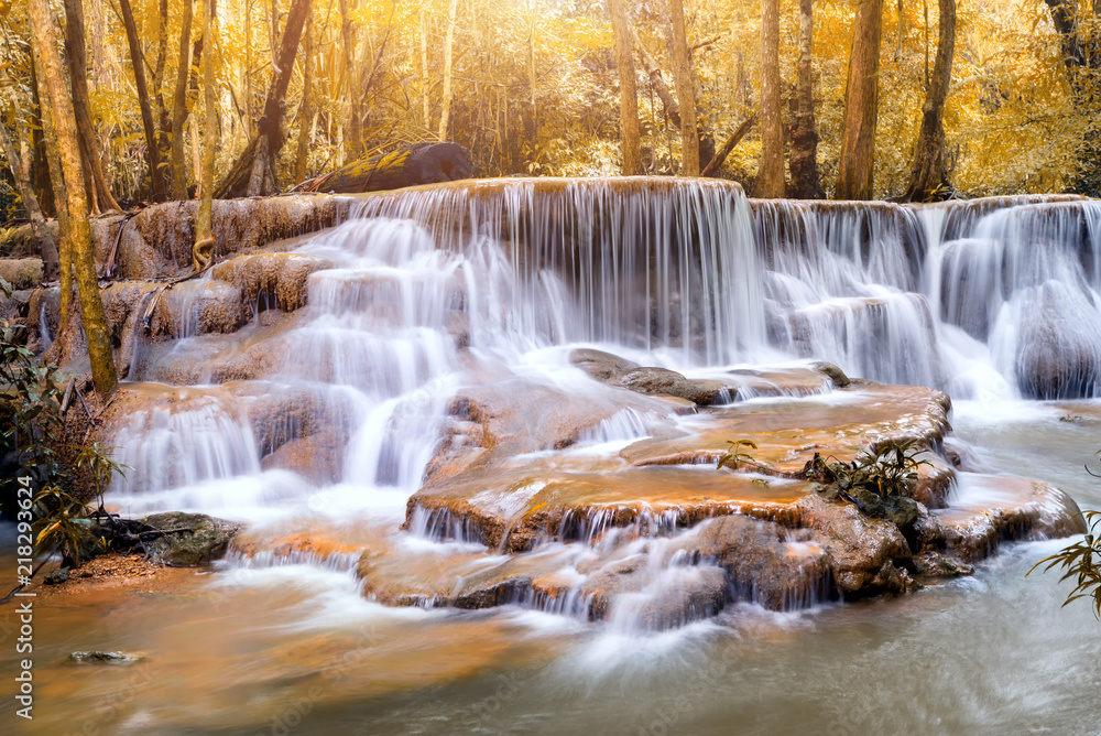 Obraz premium Autumn season of Waterfall in deep forest Huai Mae Khamin Waterfall , Kanchanaburi Thailand is popular with waterfall tourists . 