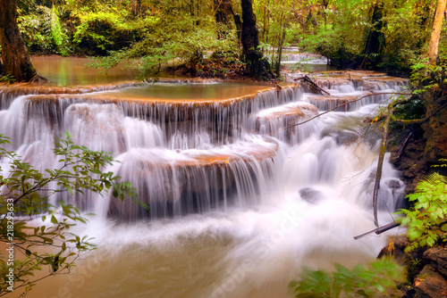  Waterfall in deep forest Huai Mae Khamin Waterfall , Kanchanaburi Thailand is popular with waterfall tourists . 