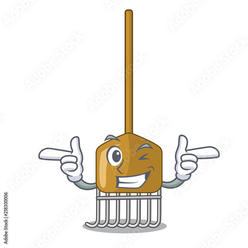 Wink cartoon rake leaves with wooden stick