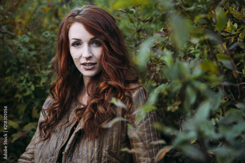 Redhead Woman in her 20's hanging out by the lake. Redhead Woman in her 20's hanging out by the lake.