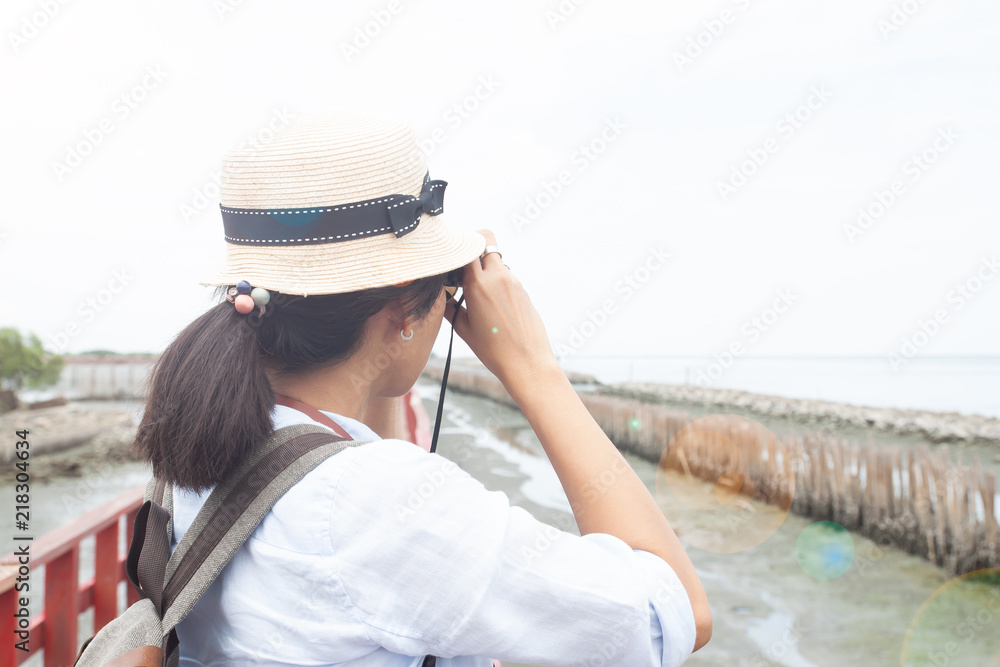 Back view of woman traveler enjoy shooting photo Back view of woman traveler enjoy shooting photo