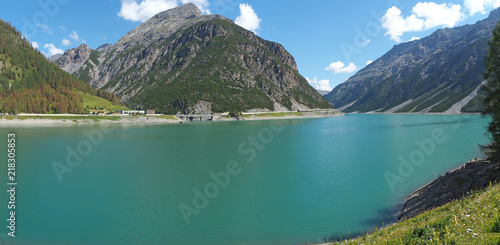 Landscape of the Lake Livigno an alpine artificial lake. Italian Alps. Italy