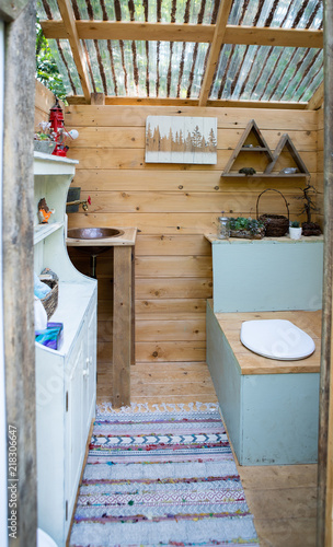 Obraz na płótnie Outdoor composting toilet stall at a glamping site w salonie