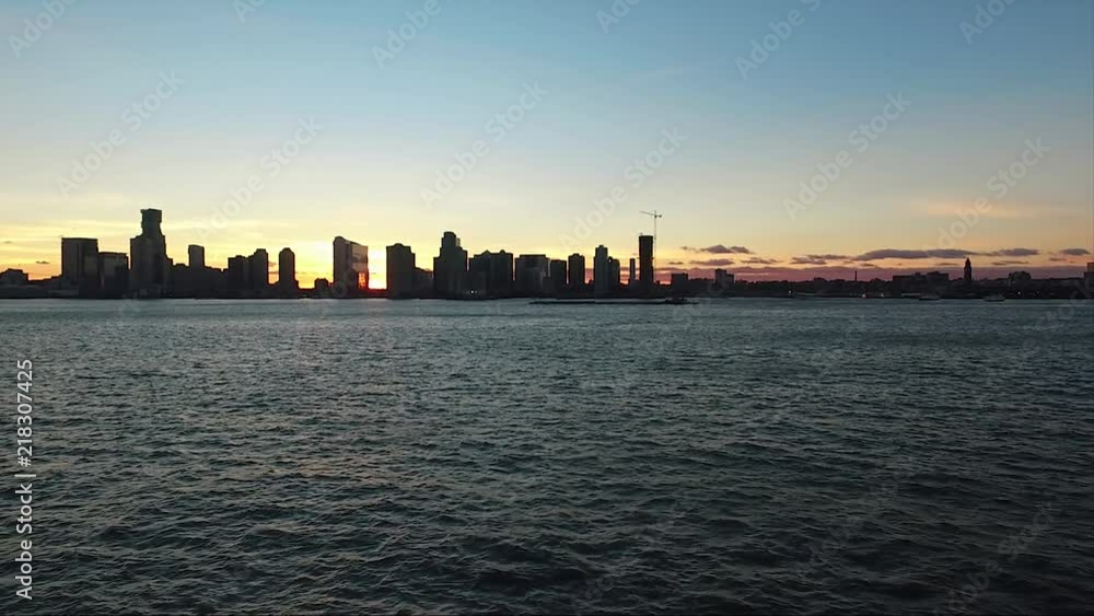 Moving Aerial Shot of New York City Showing Skyline and Seafront During Sunset Moving Aerial Shot of New York City Showing Skyline and Seafront During Sunset