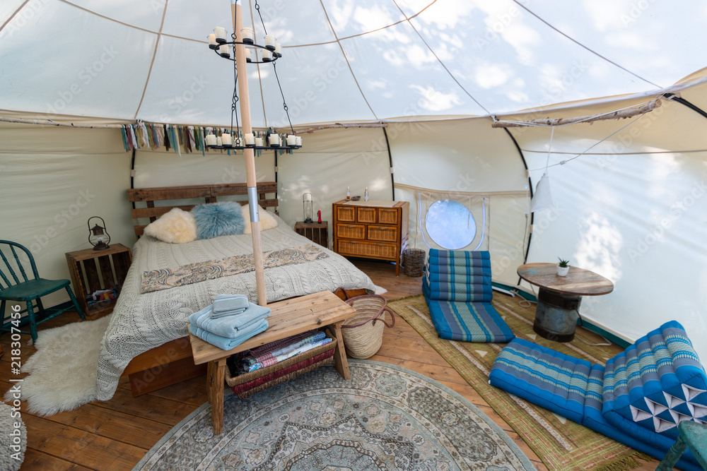 Interior of a glamping tent in a forest