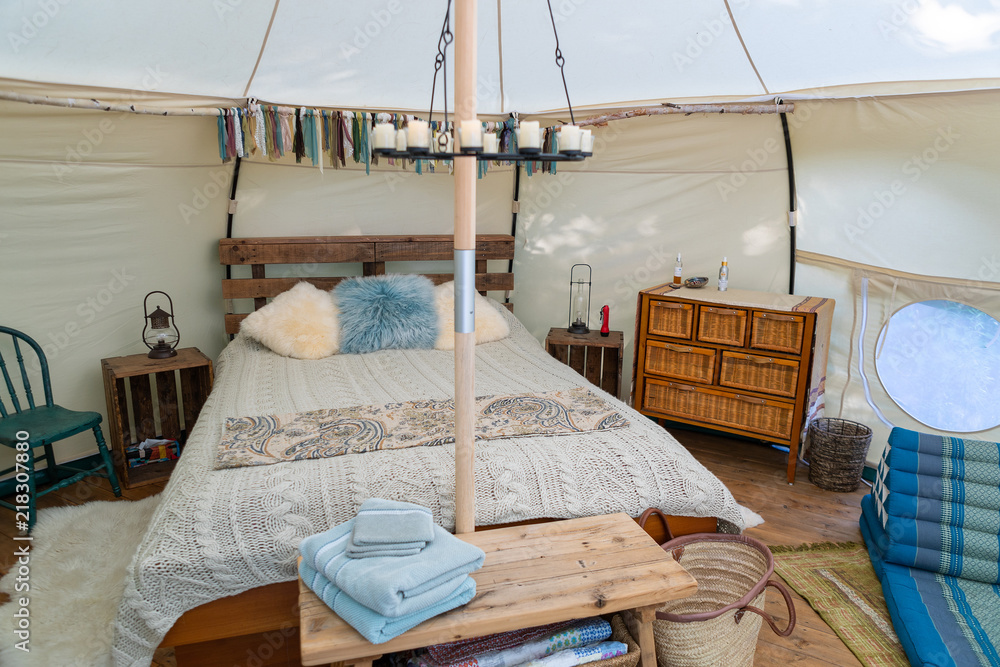 Interior of a glamping tent in a forest