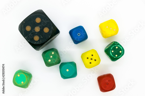 Very old and various colors plastic gaming dice on white background surface