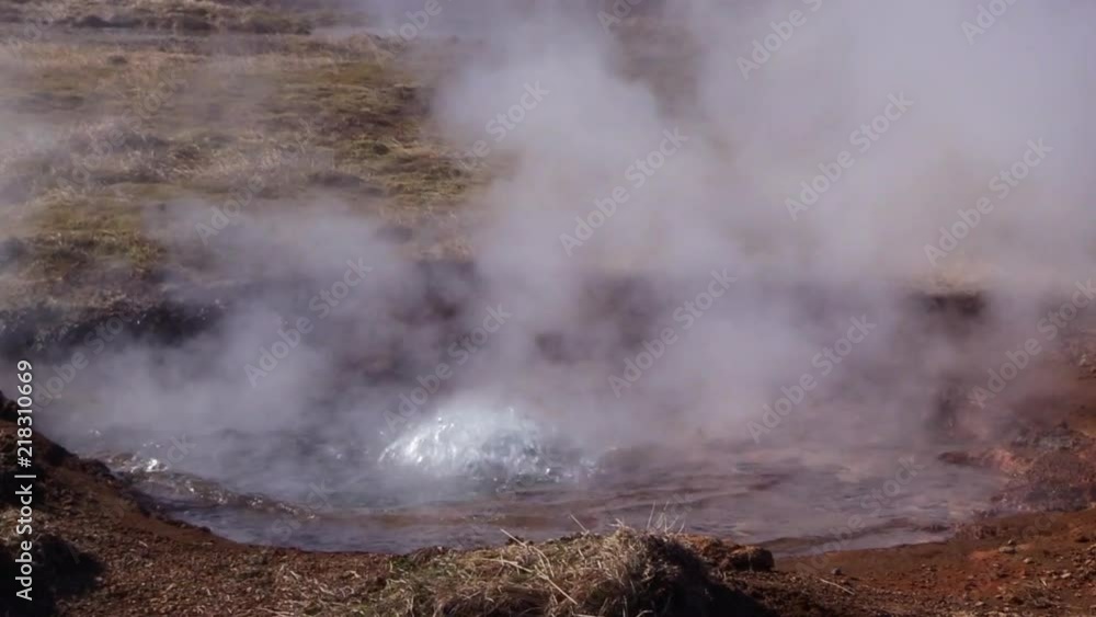 close up of steam coming from a puddle of water created by a geyser in Iceland close up of steam coming from a puddle of water created by a geyser in Iceland
