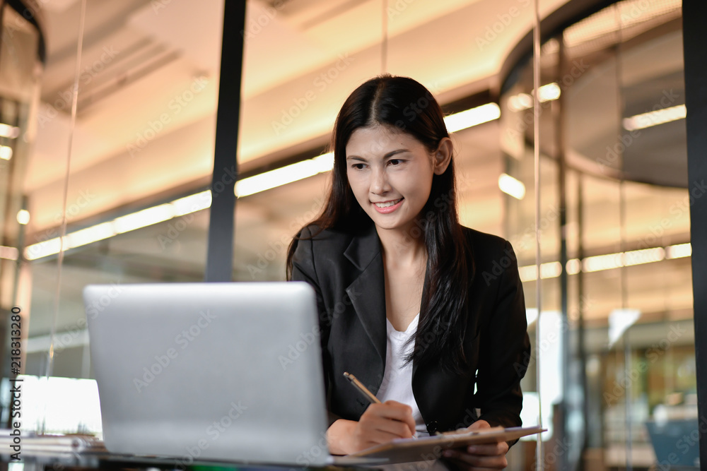 Business concept. Young businesswoman is working hard.