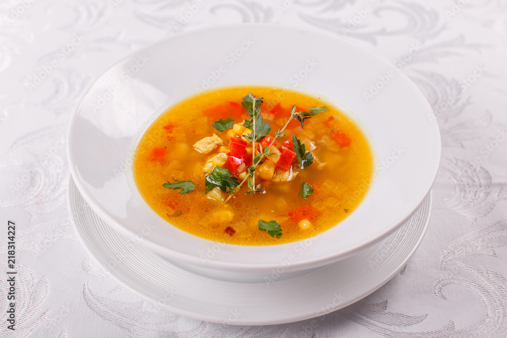 Fresh Mexican tomato soup with corn and vegetables. bowl of bean soup with rosemary. like chili con carne with tacos Fresh Mexican tomato soup with corn and vegetables. bowl of bean soup with rosemary. like chili con carne with tacos