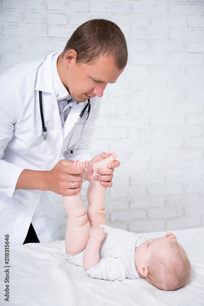 pediatry concept - doctor pediatrician examining little baby patient pediatry concept - doctor pediatrician examining little baby patient