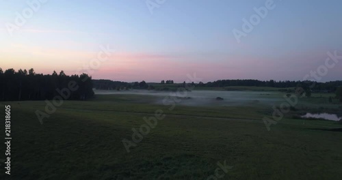 Wallpaper Mural Aerial shot of fog over rolling hills with horses during sunrise Torontodigital.ca
