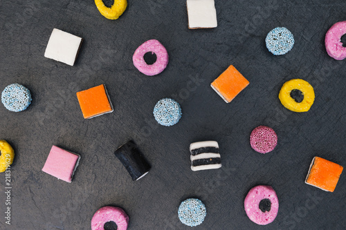 Liquorice allsorts candy sweets dark background