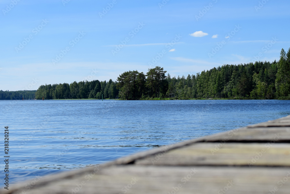 Part of wooden pier on beautiful lake in Savonia, Finland.