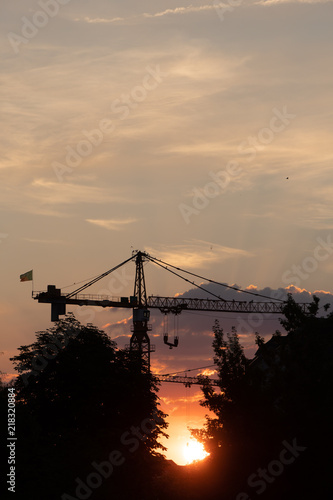 Construction site sunset with cranes