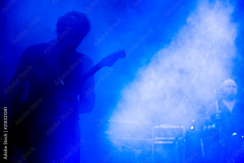 Obraz premium Guitarist on a stage playing rock