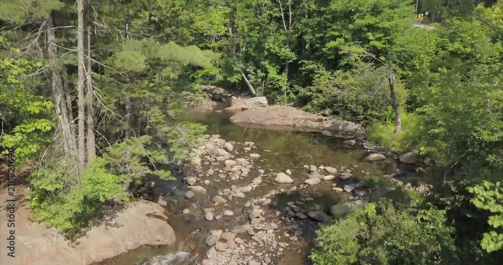 Aerial shot above a small waterfall at Small Falls in Maine. Aerial shot above a small waterfall at Small Falls in Maine.