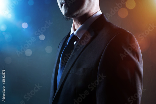 Closeup business man with crossed arms with bokeh and light flare effect apply . © jamesteohart