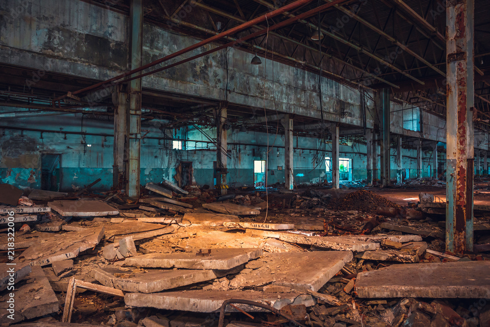 Abandoned ruins of industrial factory building, corridor view with perspective and light, ruins and demolition concept