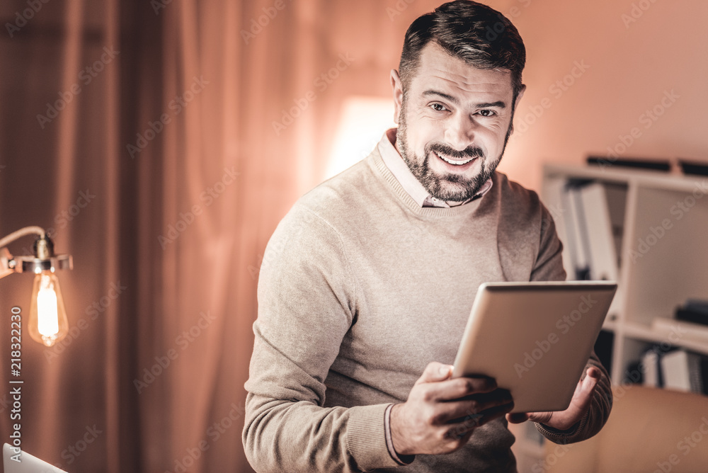 Be informed. Handsome intelligent man checking emails Be informed. Handsome intelligent man checking emails