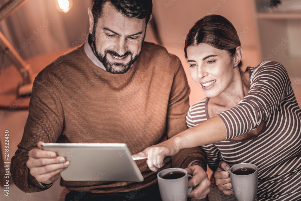 Evening coffee. Happy relaxed couple spending an evening together and drinking coffee Evening coffee. Happy relaxed couple spending an evening together and drinking coffee