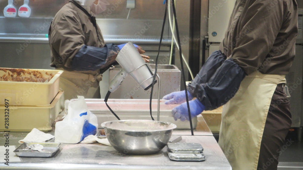 Hand of People are Making chocolate in the factory. one kind of dessert made from cocoa. Hand of People are Making chocolate in the factory. one kind of dessert made from cocoa.