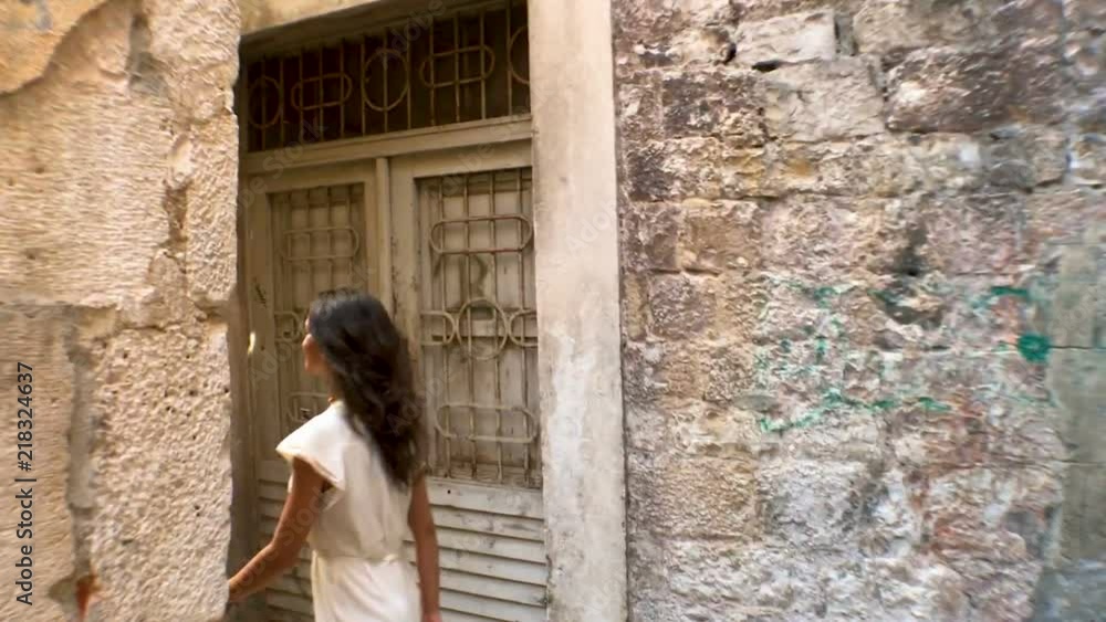 Beautiful smiling young girl walking narrow old streets of Splt old town and Diocletian palace, Split, Dalmatia, Croatia Beautiful smiling young girl walking narrow old streets of Splt old town and Diocletian palace, Split, Dalmatia, Croatia