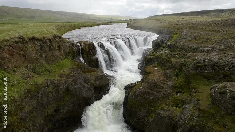 Slow motion of Kolufossar water waterfall falls in Iceland, canyon Kolugljufur gorge landscape view Slow motion of Kolufossar water waterfall falls in Iceland, canyon Kolugljufur gorge landscape view
