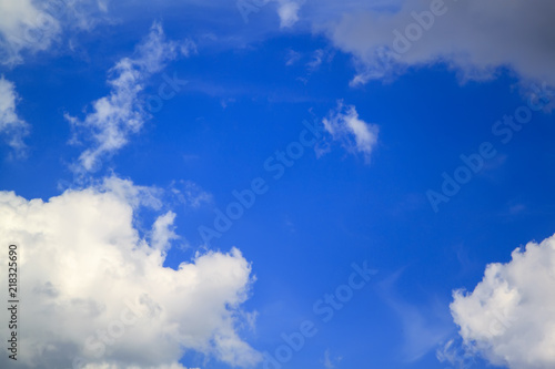 grey and white clouds on blue sky background