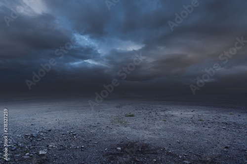 Surreal gravel dark background with dramatic sky